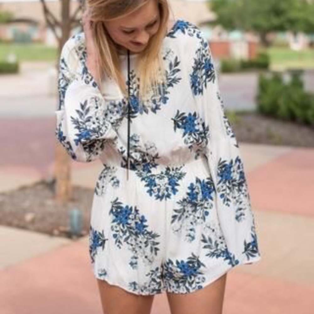 White and blue floral long sleeve romper